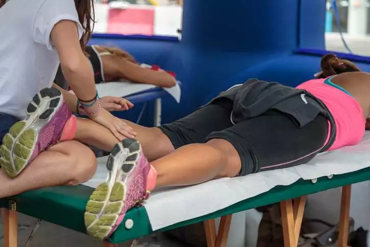 Athlete's Calf Muscle Professional Massage Treatment after Sport Workout: Fitness and Wellness