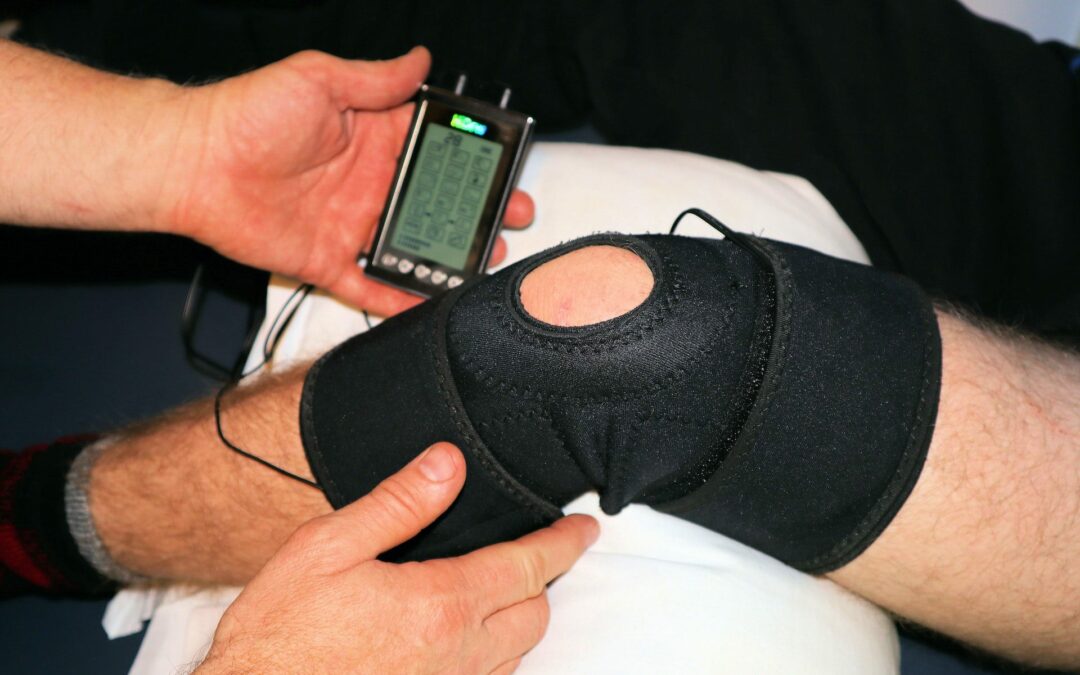 A person undergoing active rehabilitation therapy for a knee injury on a bed.