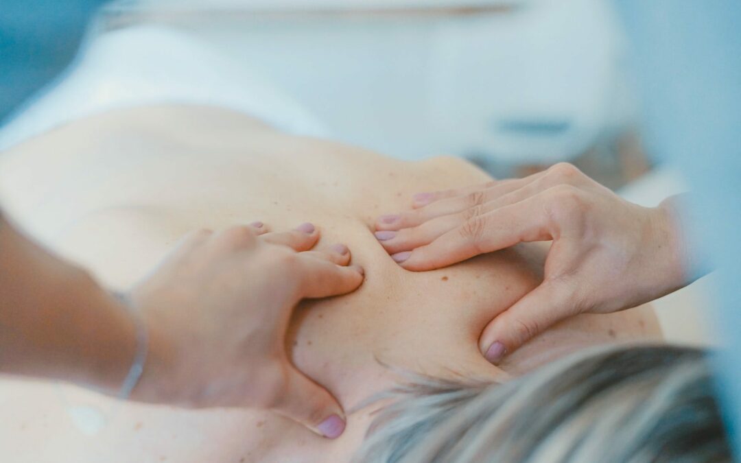 A woman getting a post-workout massage in a spa.